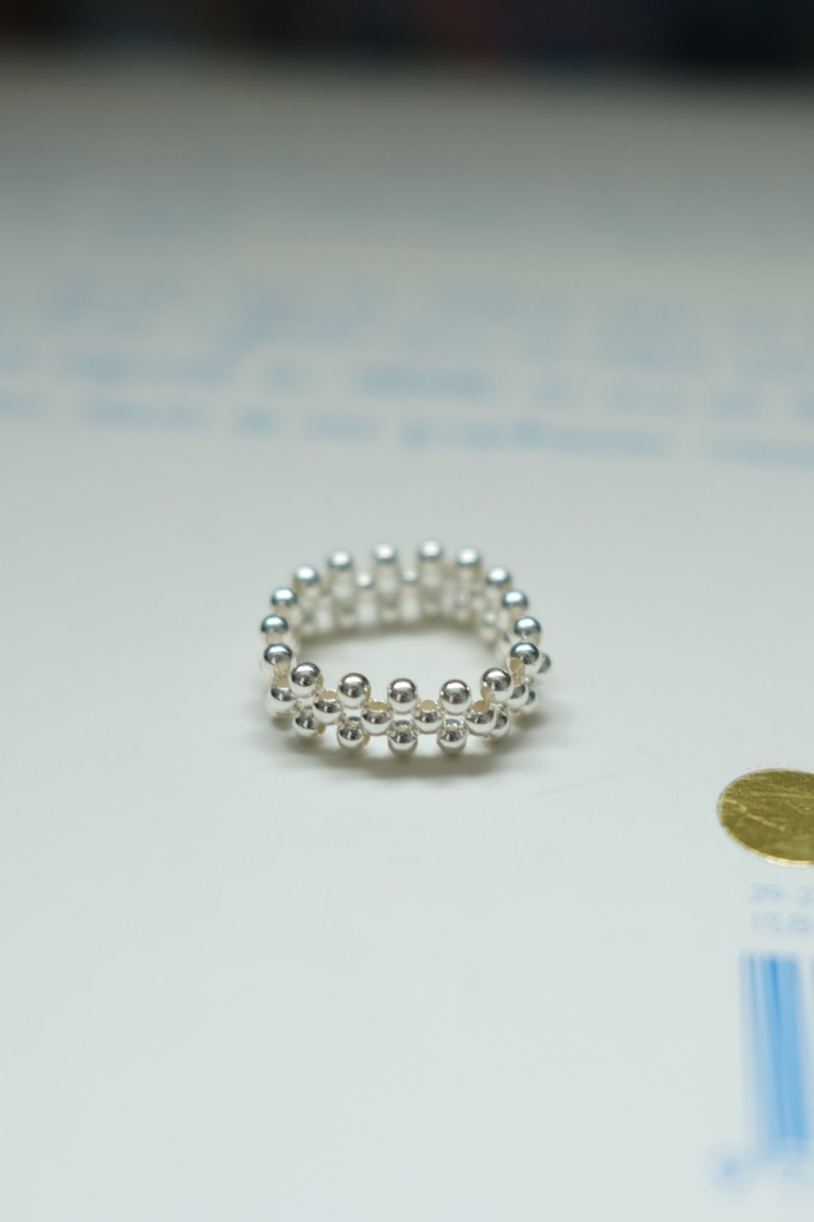 Mini ball silver banding ring