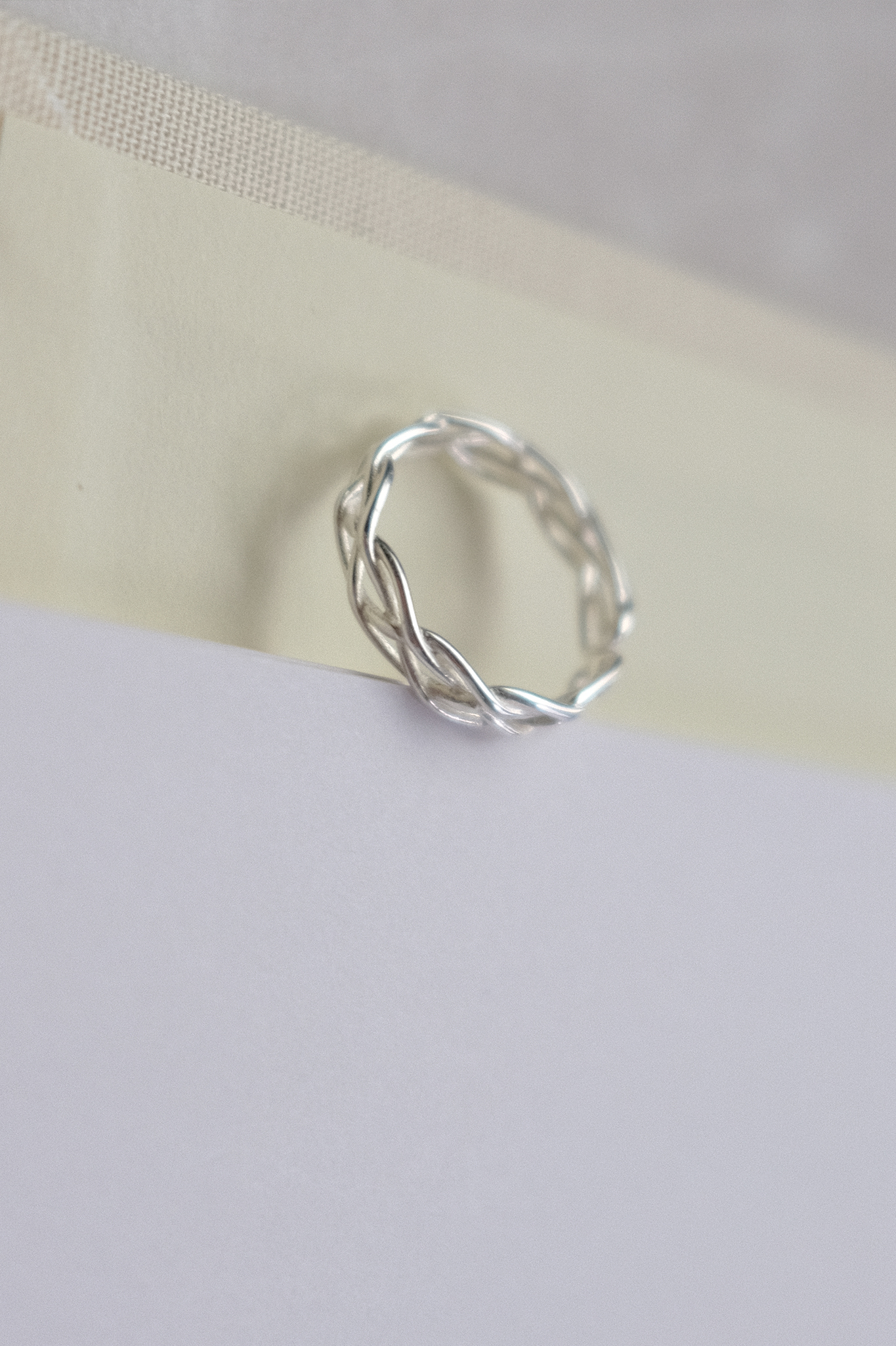Cross knotted silver ring